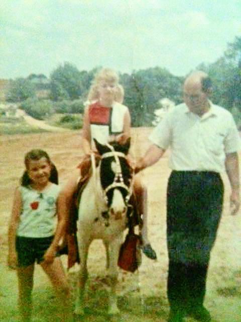 Kelly Woodham and her dad walking Christmas pony Sugar with her cousin riding. (Courtesy of Kelly Woodham)